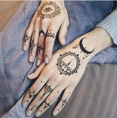 two hands with tattoos on them, one has a clock and the other has a crescent