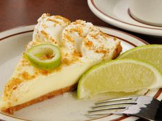 a slice of key lime pie on a plate with a fork