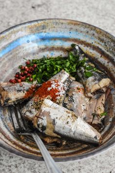 a plate with fish and spices on it