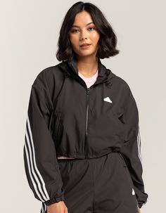 Adidas Future Icons 3-Stripes Windbreaker Jacket. On Grey Days, Give This Adidas Windbreaker A Run Out. Sturdy Yet Light, It Slips On Easily At The First Hint Of Blustery Weather. The Loose Fit Allows For Warm Layers Underneath. Full Zip With Drawcord-Adjustable Hood. Zippered Side Pockets. Silicone Adidas Logo On Left Chest. Cropped Length. Adjustable Toggles At Hem. 100% Recycled Polyester. Machine Wash. Imported. Model Is Wearing A Size Small. Model Measurements:height: 5'8" Bust: 32"waist: 2 Adidas Cropped Jacket, Striped Jacket Outfit, Windbreaker Jacket Women, Adidas Windbreaker, Adidas Crop, Womens Windbreaker, Striped Jacket, Windbreaker Jacket, Crop Jacket