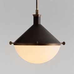 a black and white light hanging from a ceiling