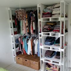 the closet is full of clothes and other things to wear in it's storage area