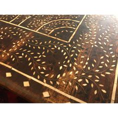 an intricately designed wooden table top