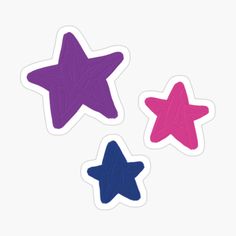 three different colored stars stickers on a white background