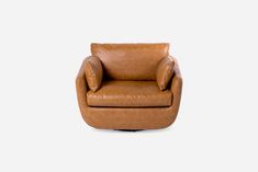 a brown leather chair on a white background