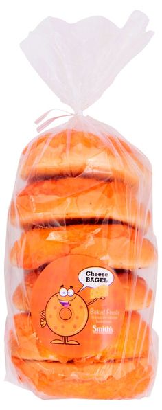 an orange sandwich wrapped in plastic on top of a white background