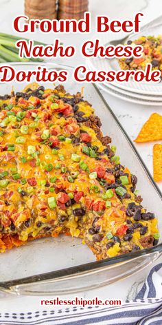 a casserole dish filled with ground beef and nacho cheese, topped with tortilla chips