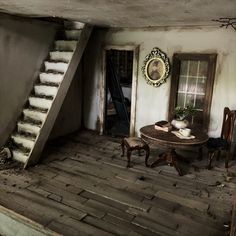 an old house with stairs leading up to the second floor and another room on the other side