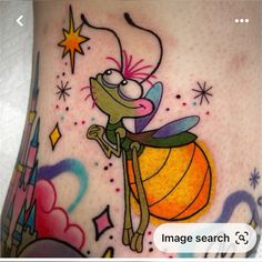 an image of a cartoon character on the side of a woman's stomach with stars and sparkles