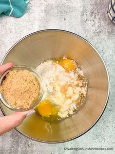 someone is mixing ingredients in a bowl on the counter for making an egg muffin