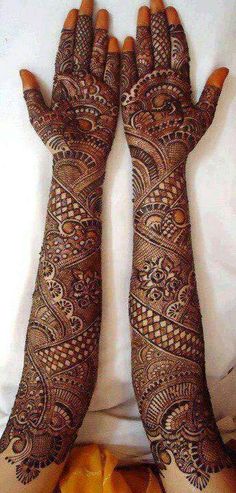 two hands that are covered in henna