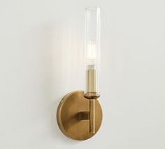 a wall light with a glass tube on it