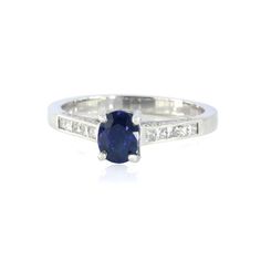 Stunning Sapphire & Diamond Ring  0.73ct Royal Blue Sapphire & 0.25ct Diamonds. Platinum Bespoke Mount 4.24 grams. This is a stunning ring that has been designed and handmade as a bespoke 'one off' piece. The main feature of this design is the high quality, Royal Blue Sapphire that weighs 0.73ct. and measures 8 x 6mm. A Platinum mount has been encrusted with sparkling Diamonds Colour G Clarity VS. 5 Beautiful Princess Diamonds have been channel set into each of the shoulders.   Combined weight o Oval Channel Set Fine Jewelry Rings, Oval Channel Set Rings Fine Jewelry, Oval Channel Set Rings In Fine Jewelry, Oval Channel Set Diamond Ring, Classic Oval Ring With Channel Set, Classic Oval Channel Set Ring, Princess Cut Promise Ring With Side Stones, Princess Cut Rings With Side Stones For Promise, Fine Jewelry Sapphire Ring With Channel Set Diamonds