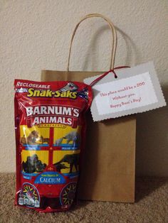 a brown bag with a label on it next to a paper bag that says barnum's animals