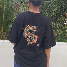 Ideal for trendsetters and culture enthusiasts, our Calligraphy Ink Dragon T-Shirt features a bold Hanzi print and a striking Chinese dragon design, perfect for fans of Chinese history, streetwear, anime, and Y2K fashion. ✅ Print Quality: Premium Direct to Garment printing with high-detail images, ensuring vibrant and lasting designs. 🥻Clothing quality: 70% Cotton, 30% Polyester ⚠️ Washing Instructions: Our shirts and prints are designed for longevity. Wash at 40oC, inside out, and without blea Streetwear T-shirt With Back Print And Short Sleeves, Short Sleeve T-shirt With Back Print For Streetwear, Cotton T-shirt With Front And Back Print For Streetwear, Harajuku Style Short Sleeve T-shirt With Graphic Design, Harajuku Style Screen Print T-shirt For Streetwear, Streetwear Cotton Shirt With Back Print, Cotton Streetwear Shirt With Back Print, Cotton Shirt With Back Print For Streetwear, Hip Hop Tops With Back Print And Short Sleeve