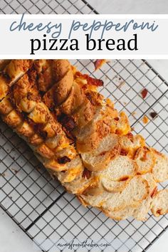 cheesy pepperoni pizza bread on a cooling rack with text overlay that reads cheesy pepperoni pizza bread