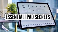 an ipad with the words essential ipad secrets on it, in front of a glass table