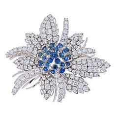 It is so hard to come by a beautiful sapphire and dimaond brooch that has just enought diaonds and just enough of diamonds. And when finding one you rarely see a brooch that as pretty as this one. It is perfect in size and in quality and can be worn on your daily outings as well special occasions. Made in 18K White Gold with brilliant diamonds and lively blue round sapphires we guarantee you will will fall in love with this dimentional flower cluster. There are 150 diamonds and sapphires collectively. Approx. 13cttw. Overall width 5cm. Argentium Silver Jewelry, Blue Sapphire Necklace, Diamond Bows, David Webb, Round Sapphire, White Gold Sapphire, Wedding Brooch, Silver Prices, Natural Blue Sapphire