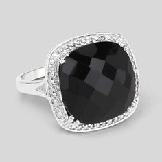 Flaunt yourself with this black onyx halo ring. The natural gemstones have a combined weight of 9.77 carats and are set in .925 sterling silver with rhodium plating. The hard black hue of this ring adds a pop of color to any look! The understated design and vibrant stones make this ring perfect for every occasion. Cushion Halo Ring, Onyx Silver Ring, Black Onyx Jewelry, Cushion Halo, Bold Rings, Onyx Jewelry