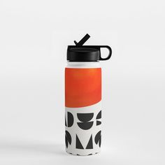 a water bottle with an orange and black design on the front, sitting against a white background