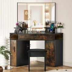 a vanity with mirror and stool in a room