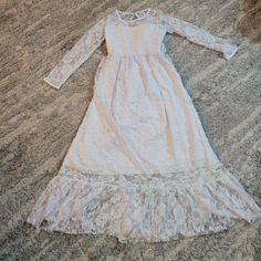 Girl Withe Party Dress Size Age 10-11, Preown, New With Tags. Good Condition. Princess Style Spring First Communion Dress, Spring Princess First Communion Dress, Spring First Communion Dress Fitted For Party, Long Sleeve Lace Princess Dress For Dress-up, First Communion Dress With Lace And Ruffles, Lace First Communion Dress With Ruffles For Party, Long Sleeve Lace Princess Dress For Party, Long Sleeve Confirmation Dress With Lace Trim, Rainbow Sequin Dress