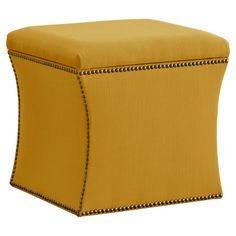 a yellow ottoman with zippers on it