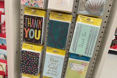 some cards are hanging up in a store