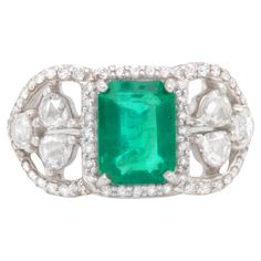 Emerald = 1.73 Carat (Cut: Emerald, Color: Green, Origin: Natural) Diamond = 1.09 Carats (Cut: Mixed, Color: F, Clarity: VS) Metal = 18K White Gold Ring Size = 6 Emerald Ring With Diamonds, Emerald Color, White Gold Ring, Emerald Ring, White Gold Rings, Cocktail Rings, Diamond Rings, Gold Ring, Natural Diamonds