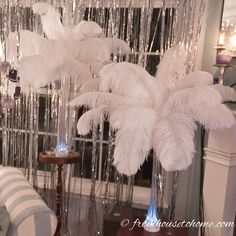 white feathers hanging from the ceiling in a living room