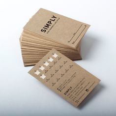 several business cards stacked on top of each other with the words simply printed on them