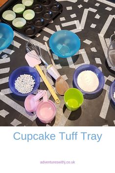 cupcakes, muffin trays and measuring cups on a table with the words cupcake tuff tray