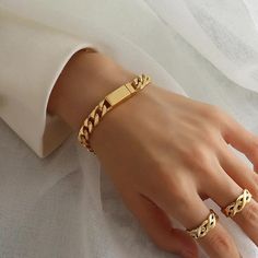 Add a touch of elegance and sophistication to your wrist with this stunning Sanza London Luxury geometric chain bracelet. Crafted from high-quality 18K gold-plated stainless steel, this bracelet features a thick magnet-GOLD chain that is both stylish and practical. Measuring 17.5 cm in length, this bracelet is perfect for any occasion, whether it's a special event like a wedding or anniversary, or an everyday accessory. The bracelet is designed with a magnetic closure, making it easy to wear and Gold Bracelet Women, Bracelet With Name, Gold Cuban Chain, Cuban Chain Bracelet, Cuban Bracelet, Chunky Gold Chain, Body Oils, Gold Bracelet Chain, Layered Bracelets