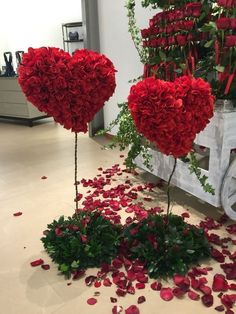 two heart shaped flowers are on the ground