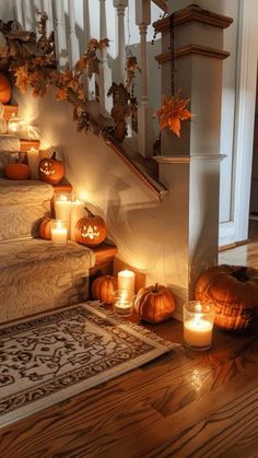 pumpkins and candles on the stairs in a home