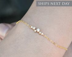 This beautiful CZ diamond cluster bracelet is perfect for everyday wear and adds just the right amount of sparkle. The diamond bar cluster measures approximately  4mm x 13mm and is made of plated 14k gold, rose gold, and silver and can be hung on a plated chain or a 14k gold filled, rose gold filled, or sterling silver chain. This bracelet is so delicate and pretty - the perfect piece to dress up or down and is sure to be your new favorite jewelry!  Click here for the matching necklace: https://etsy.me/3YHCAkO HOW TO ORDER * Select the finish in the drop-down The bracelet you can choose from 6 or 7 inch length and it comes with a 2 inch extender. MORE INFORMATION * This necklace will ship within 1-2 business days  * Each necklace comes beautifully packaged in our white gift box and ready t Dainty Diamond Bracelet For Party, Minimalist Wedding Diamond Bracelet With Adjustable Chain, Bracelet Layering, Cluster Bracelet, Cluster Bracelets, Rose Gold And Silver, Diamond Bar, Minimalist Bracelet, Silver Prices