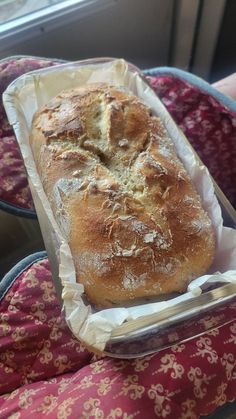 a loaf of bread sitting in a plastic container