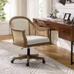 an office chair sitting on top of a rug next to a desk with a lamp