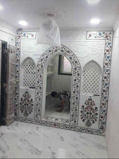 an ornate white room with marble floors and walls