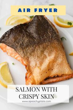 salmon with crispy skin on a white plate