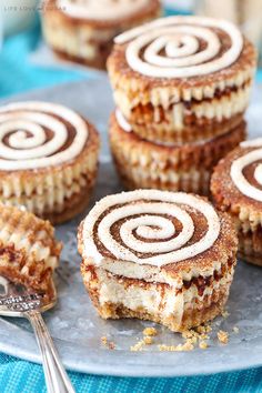 several desserts on a plate with forks