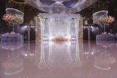 an elaborately decorated ballroom with chandeliers and tables set up for a formal function