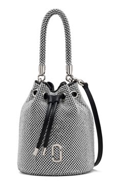 Gleaming logo hardware and a lustrous mesh exterior add eye-catching elements to a scaled-down bucket bag fitted with multiple straps for styling versatility. Drawstring closure Top carry handle; removable, adjustable crossbody strap Flat base for stability Lined Textile/glass Imported Marc Jacobs Logo, Mini Bucket Bags, Mini Bucket, Bags Logo, Mesh Bag, Color Crystal, Crossbody Strap, Mini Bag, Marc Jacobs