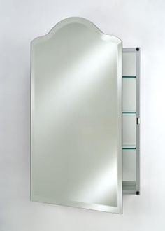 a mirror that is on the wall next to a shelf