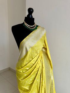 Classic and timeless Banarasi silk saree in yellow. Vibrant yellow silk saree with plain contrast blouse with border for sleeve cuffs. Rich gold zari. Perfect statement saree that's bang on trend for wedding and events. Koorai style saree for all traditional events. Rich pallu with zari and tassels, available in other colours. Blouse: plain running material with border for cuffs, unstitched Yellow Pre-draped Saree For Festivals, Yellow Pre-draped Saree With Unstitched Blouse, Elegant Yellow Pre-draped Saree With Zari Weaving, Gold Art Silk Pre-draped Saree With Border, Gold Paithani Silk Pre-draped Saree, Yellow Pre-draped Saree With Zari Work, Elegant Yellow Pre-draped Saree With Traditional Drape, Gold Pre-draped Paithani Silk Saree For Festivals, Festive Yellow Saree Blouse Piece