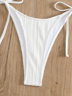 Soak up the sun in the Coco Bikini Set, where chic meets comfort in a luxurious package. This alluring white two-piece features a textured fabric with a hint of shimmer, halter neck ties for the perfect fit, and charming side-tie bottoms that offer both style and adjustability. Make a splash with its flattering ruched detailing and delicate front clasp, ensuring you're the embodiment of poolside grace. Specs: Material: Polyester White Dress Top, White Two Piece, Boho Swimwear, Vest Crop Top, Soak Up The Sun, Boho Kids, White Long Sleeve Dress, Long Romper, Short Kimono