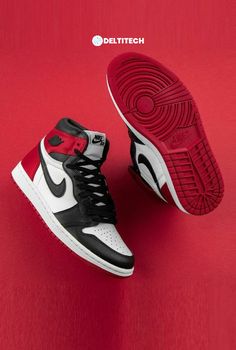 a pair of black and white sneakers on a red background