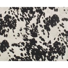 an animal print fabric with black and white spots