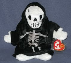 a stuffed animal wearing a skeleton outfit