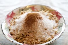 a close up of a bowl of food with sugar on top and powder in the middle